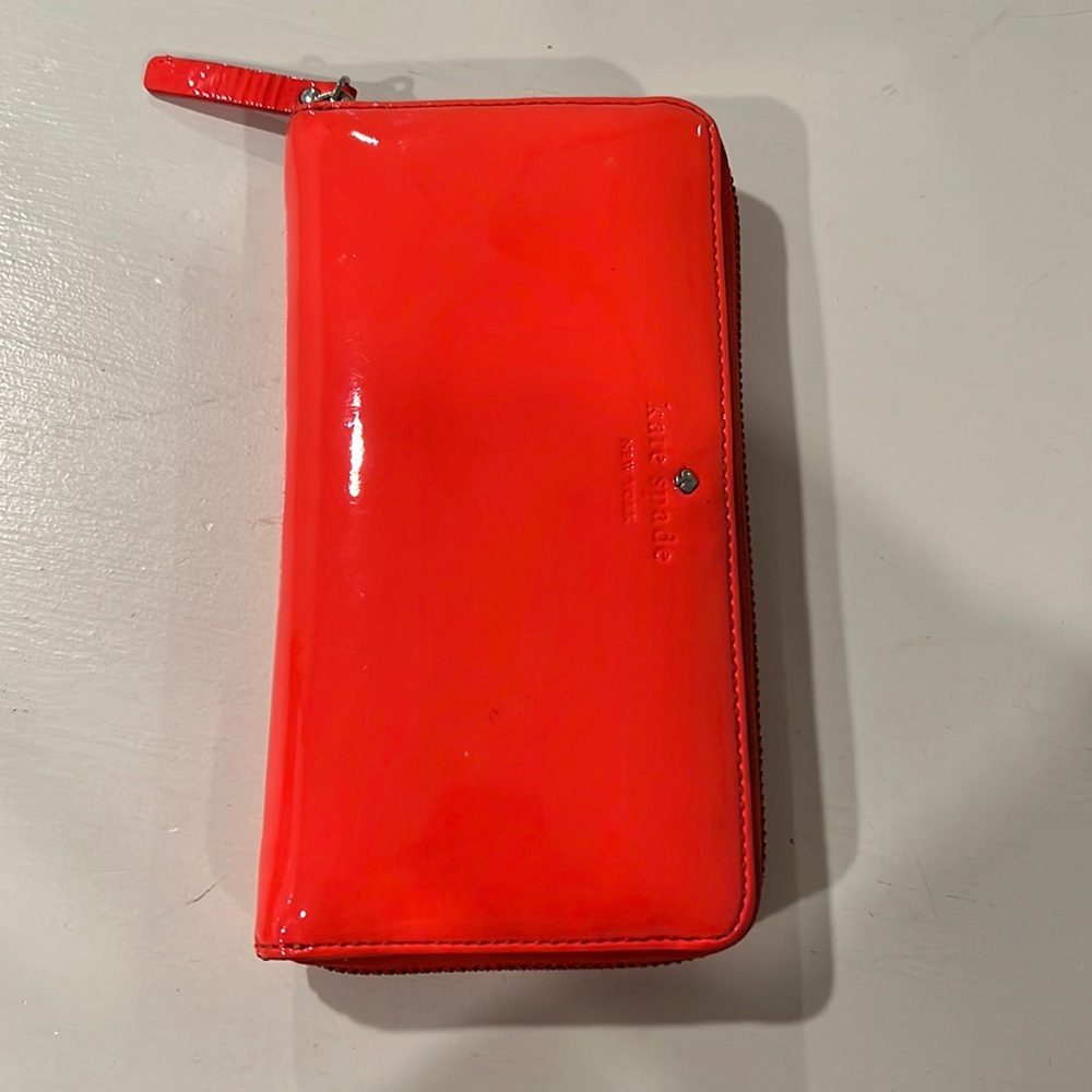 Bright orange Kate Spade patent leather wallet